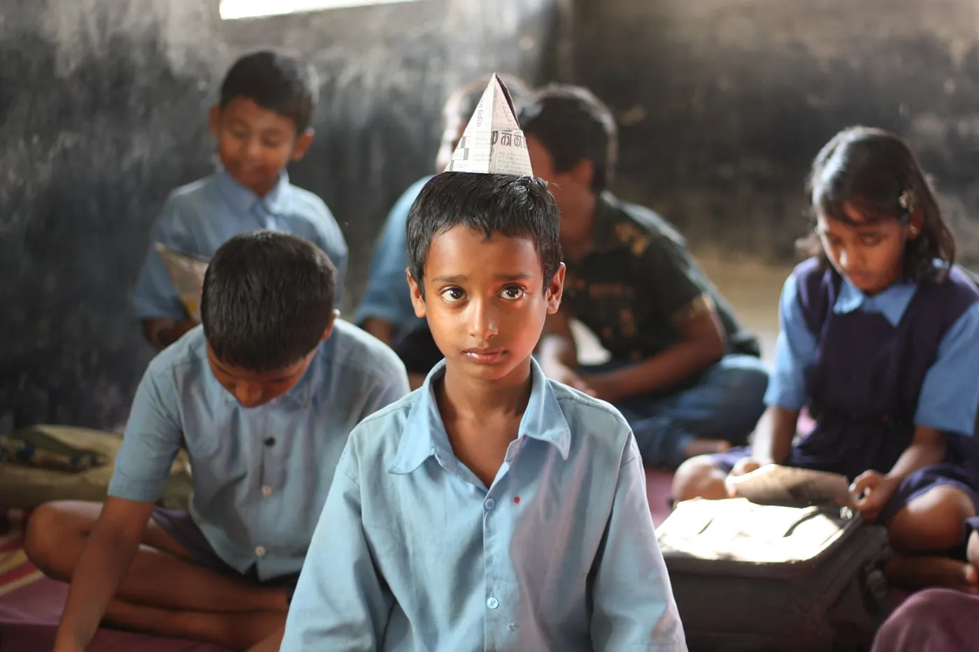 A student looking towards the camera during a classroom activity